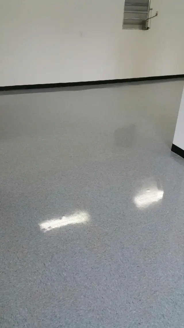 A maintained vinyl composition tile floor with a high finish
